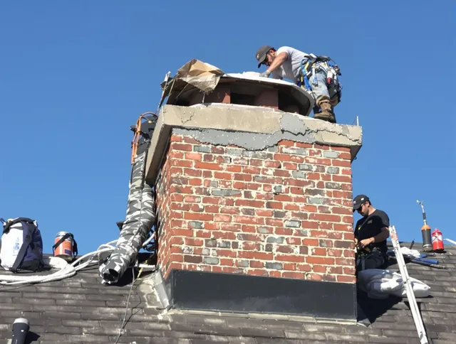 Aliso Viejo Chimney Sweep installing a custom chimney crown in Aliso Viejo, CA