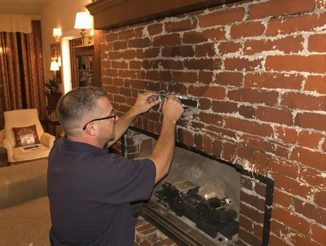 Aliso Viejo Chimney Sweep expert fixing a fireplace in Aliso Viejo, CA